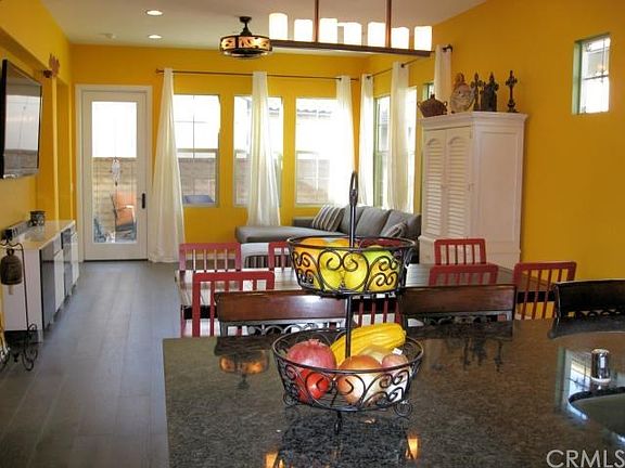 The great room encourages conversation and and easy flow for entertaining. Note the custom ceiling f