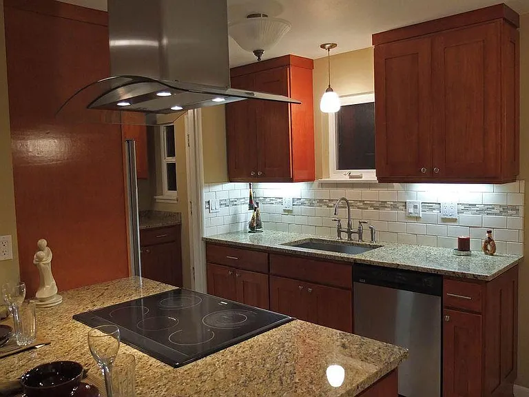 Slab granite counters and updated cabinets