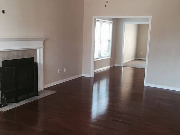 Family room with Fireplace and Ceiling Fan