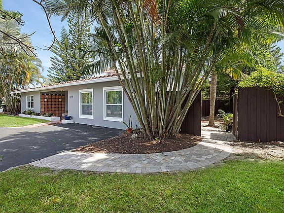 Beautifully cared for and landscaped lawn. Double wooden gates, two private patios. New sod and sprinkler system.