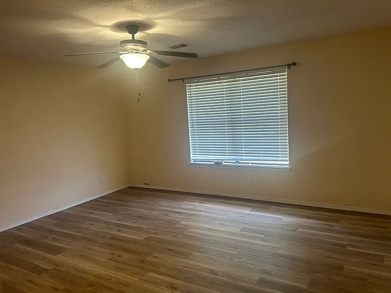 Master Bedroom with double window facing the backyard