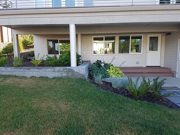 Door (to the right) is apt entrance. Surrounding patio for tenant use.