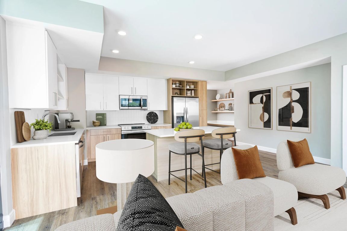 Sleek lines, wood-style flooring, and custom cabinetry_our open-concept kitchens create a clean, contemporary space perfect for everyday living or entertaining.