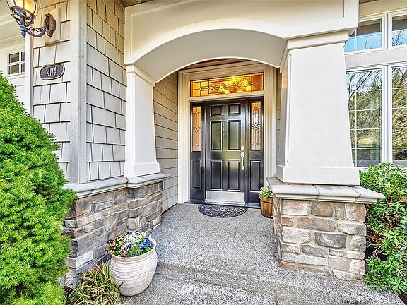 Beautiful Leaded Glass Doorway And Covered Front Porch Welcomes You Upon Entering The Home.