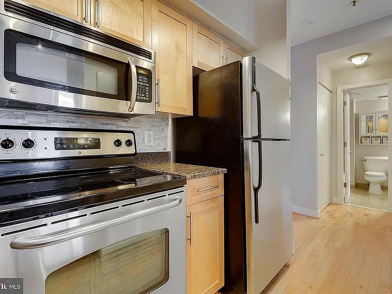 Kitchen with granite countertop and stainless-steel appliances