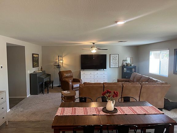 Living room and dining area from view of the kitchen