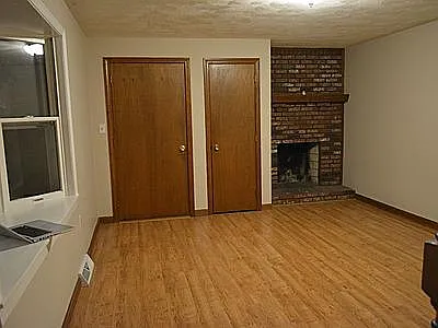 Living Room with Wood Burning Fireplace