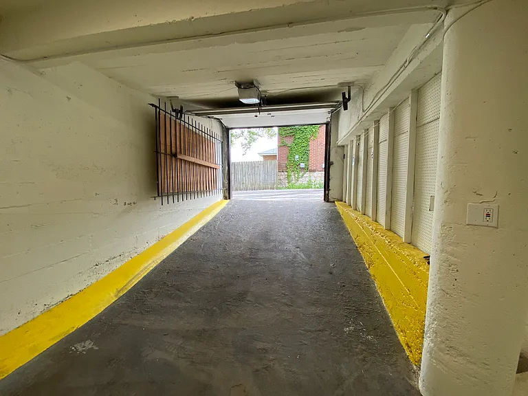 A private garage entry allows vehicles to access the space directly from the alley, creating easy loading, unloading, and operational efficiency.