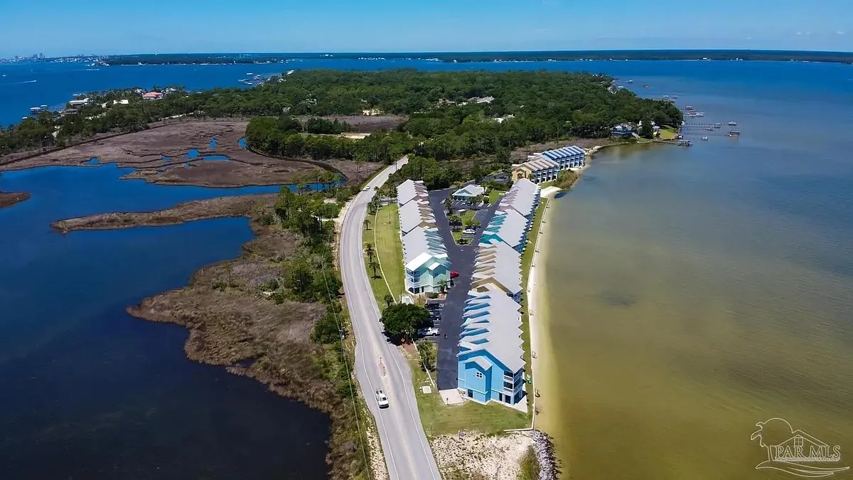 The community sits on a narrow peninsula where Perdido Bay shimmers to the north, while the Intracoastal waterway flows to the south offering a dynamic waterway backdrop. - 16008 Innerarity Point Rd