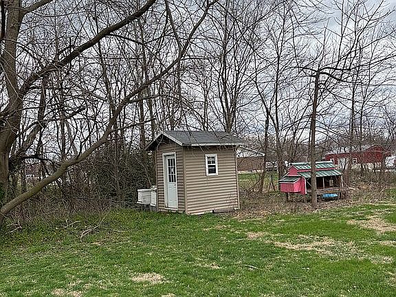 Tool shed, bee hives, back