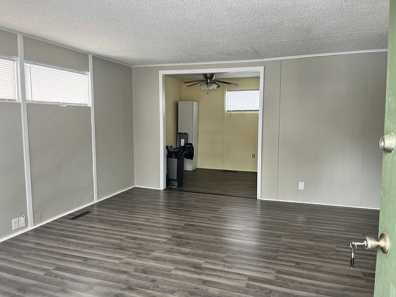 View from front door into living room. Beautiful new flooring.