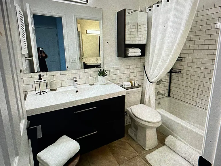 Upstairs bathroom virtually staged.