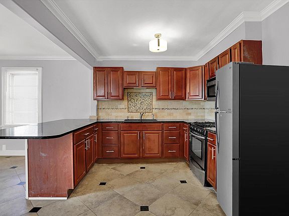 Large open design kitchen with stainless steel appliances