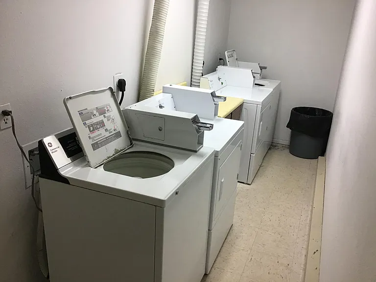 This is our on site coin operated laundry. Two washers and two dryers located on the ground floor inside the building.