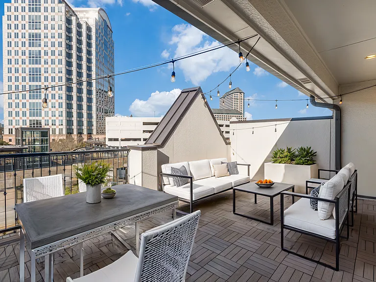 4th floor rooftop terrace overlooking Las Colinas Blvd has been virtually staged for layout and design.