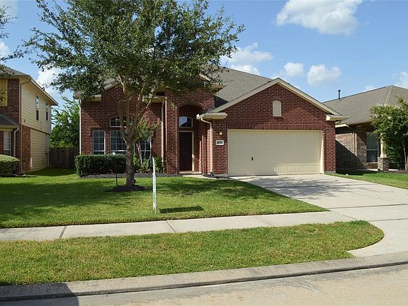 Spacious red brick two story with sought after open floor plan & high ceilings.