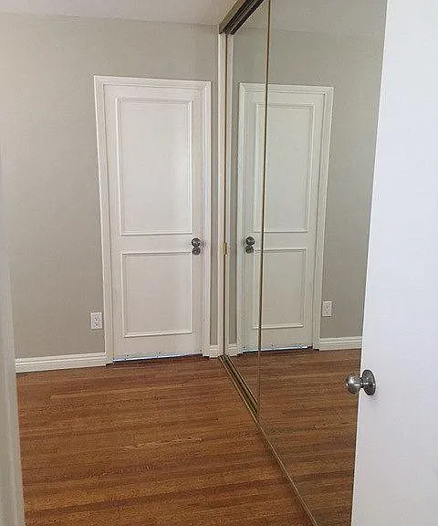 Bedroom with Door to Garage