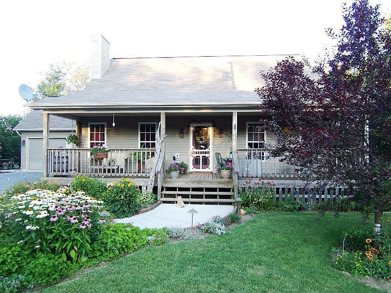 Wide front porch defines entrance of this attractive home