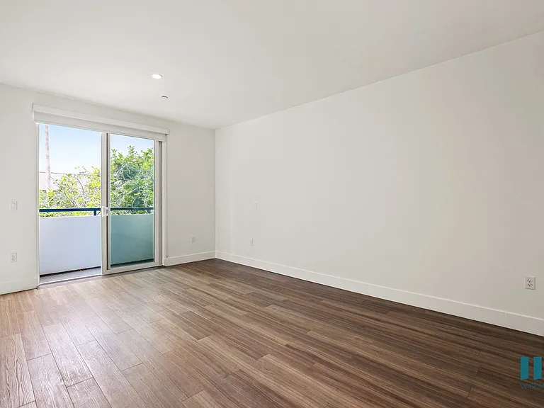 Living Room with Patio, Vinly Flooring, and Recessed Lighting