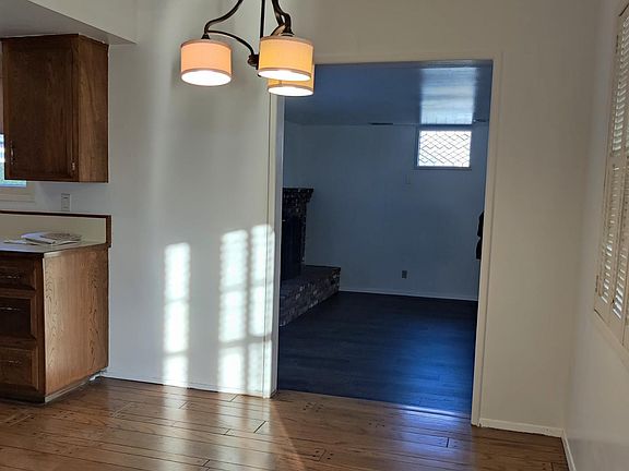 Cozy dining area next to kitchen and step-down gathering room.