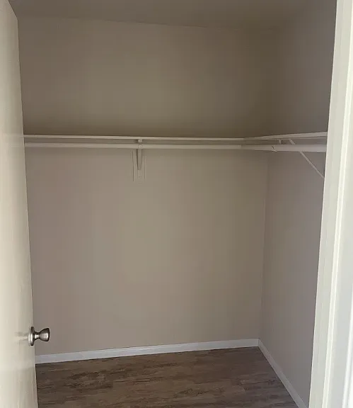 Walk in closet in one bedroom