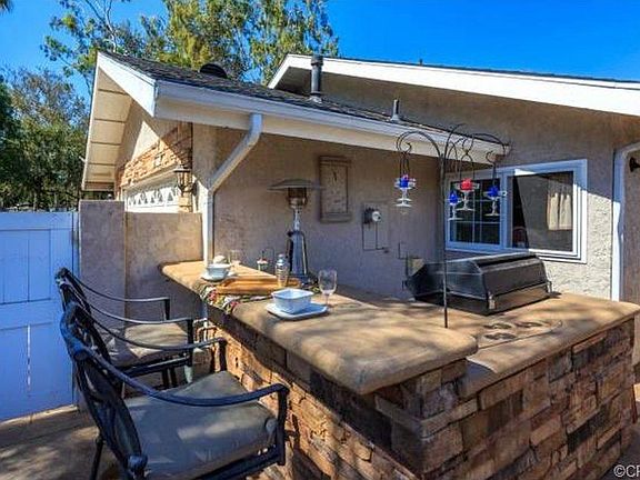 BBQ island surrounded by old trees