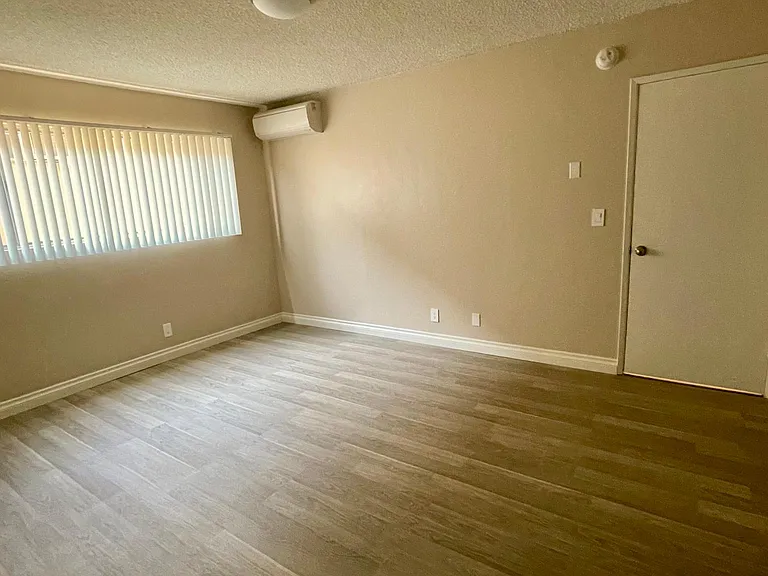 Wide angle view of Master bedroom from Master bathroom