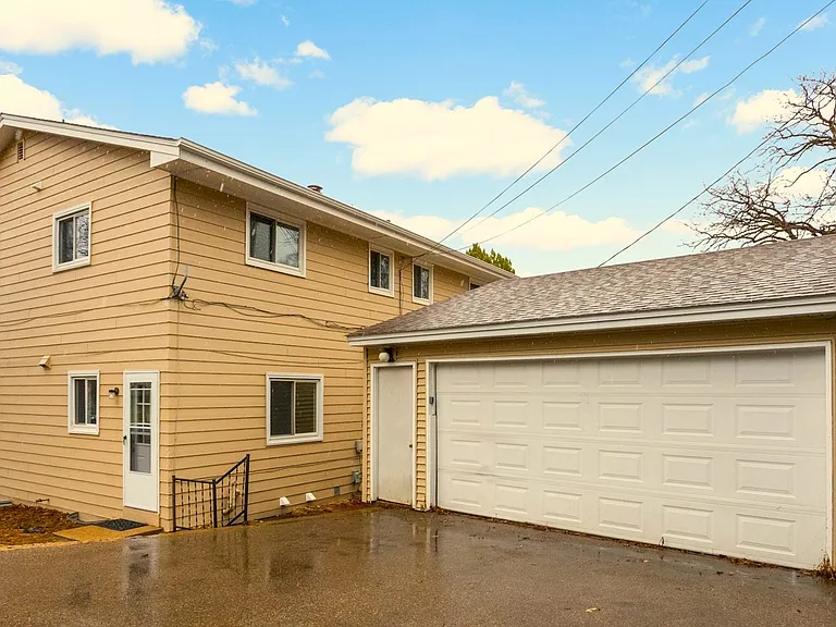 1 garage stall included plus additional driveway parking