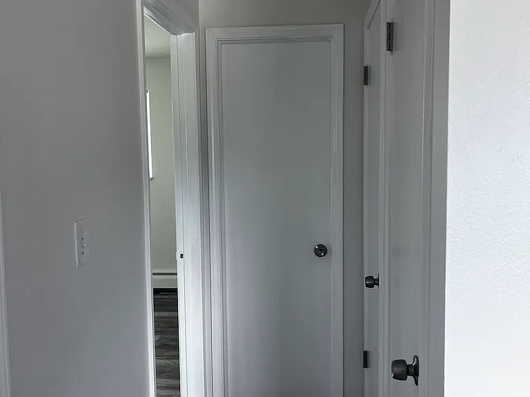 Hallway, two storage closets, and access to bedroom 2 and bathroom