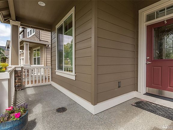 Covered Front Porch & Entry Welcomes Your Guests.