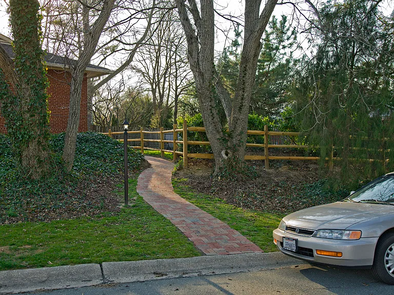 On street parking with brick walkway to entrance (2 large trees no longer there)