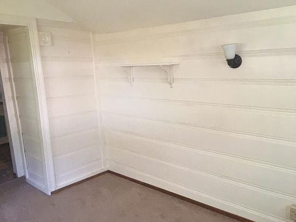 Living room looking 
East with partial view of opening to kitchen.
