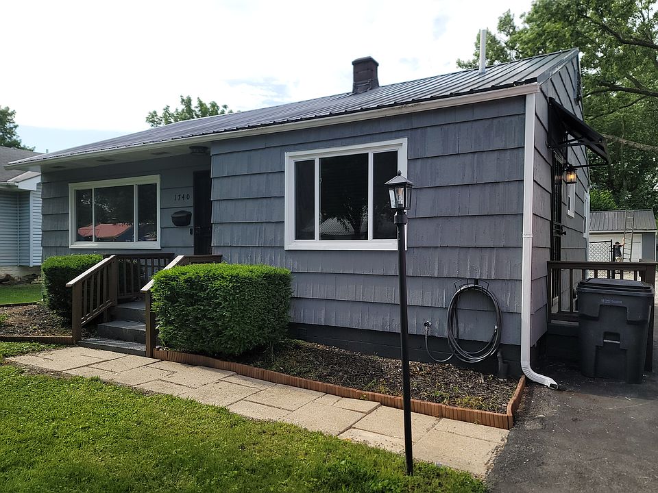 Outside Front 
Newer windows, post lamp, front door with security door, and new metal roof.