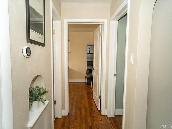 Hallway to bedroom, bathroom, and occupied office.