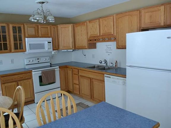 The kitchen was remodeled with Oak cabinets and White appliances.  Plenty of storage and ample counter space.  The kitchen floor is completed with ceramic tile and there is a huge pantry for additional supplies and oversized cooking pots and pans.