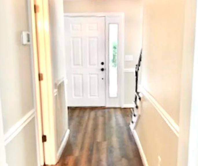Foyer with half bath.