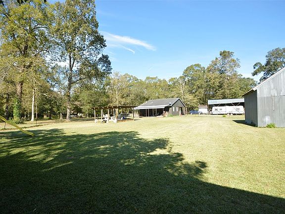 VIEW TO FENCED-IN PORTION OF PROPERTY.