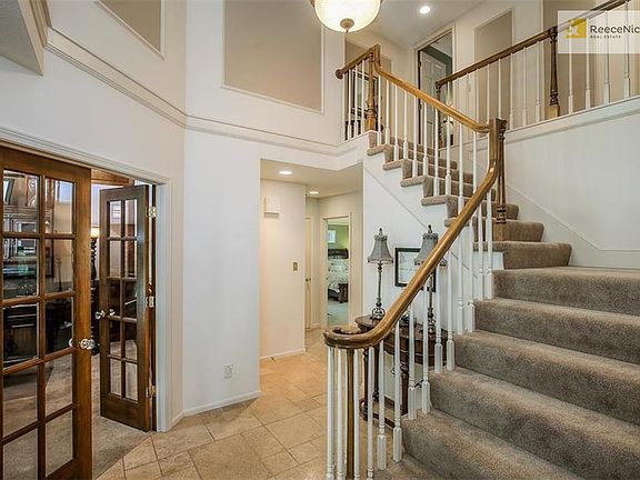 Master bedroom off spacious front entrance and three bedrooms upstairs.