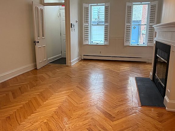 Front door area includes separate vestibule with original door.