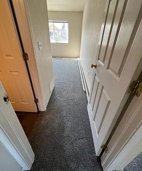 Master bedroom straight ahead; doorway to 2nd floor bedrooms, bathroom on far left.