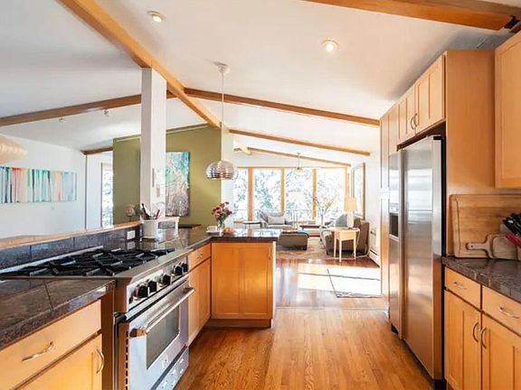 Sizable kitchen with blue-star gas stove and high-end cooking equipment.