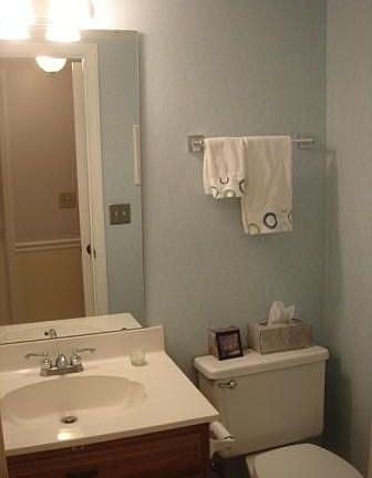 Powder room with new ceramic tile flooring