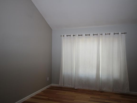 Dining Area of Living Room, Wood Flooring through out.