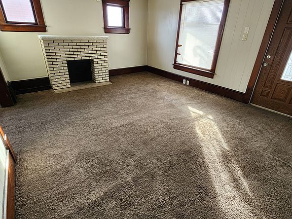 Living room with decorative fireplace