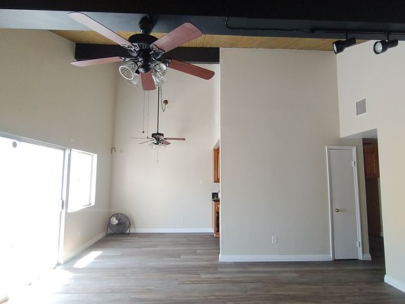 Living room and dining area with fresh paint and brand new floors