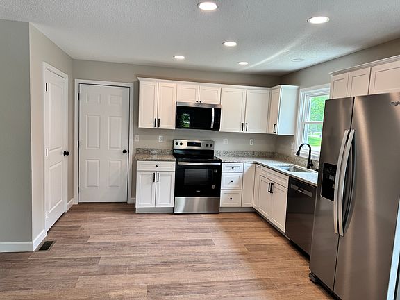 Kitchen with pantry and garage access