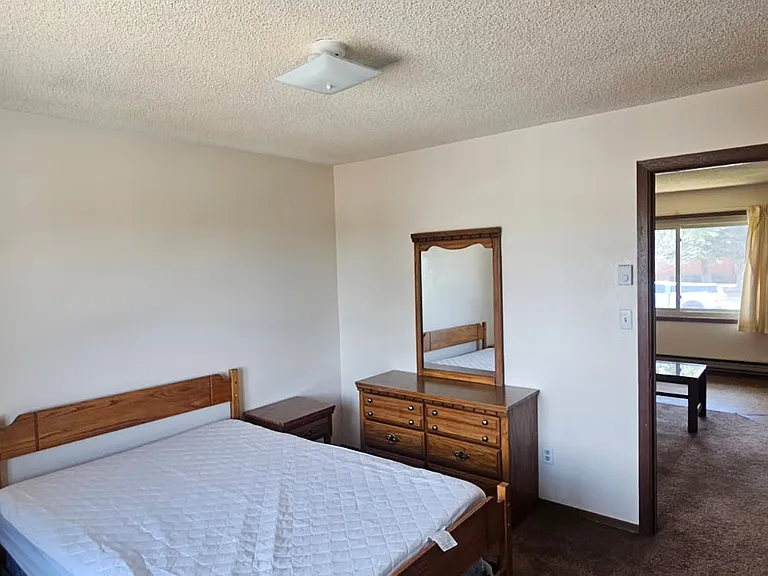 Furnished bedroom with full bed