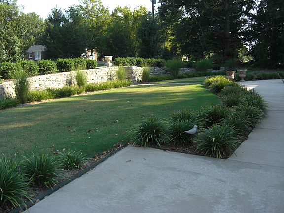 Shrubbery and Retaining Wall in Front of House
