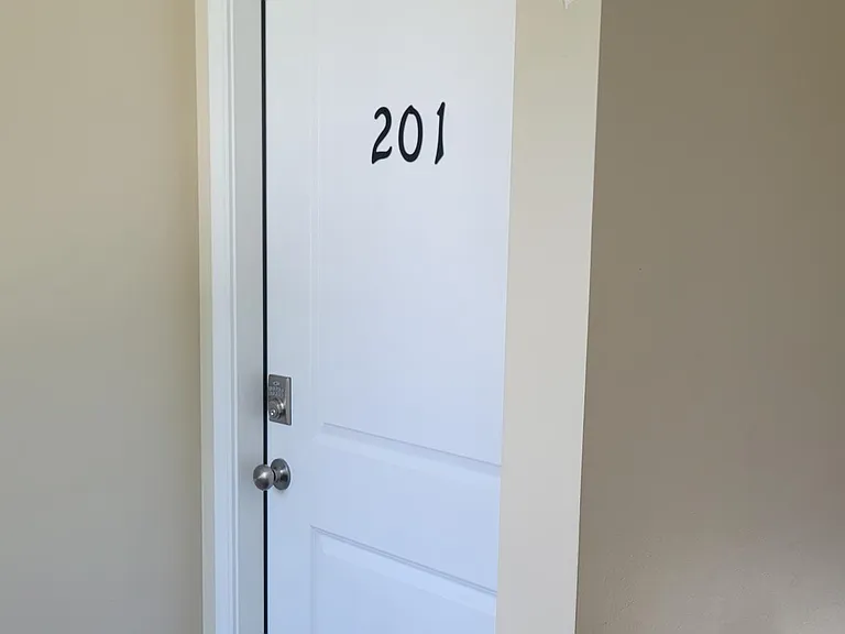 Entry to Apt. #201. Push button key code lockset.