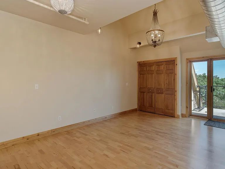 Living room, washer and dryer in closet.